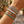 Load image into Gallery viewer, Close-up of a wrist wearing multiple bracelets with a blurred outdoor background
