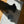 Load image into Gallery viewer, Cat interacting with a gray bowl on a white mat with black patterns on a wooden floor.
