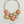 Load image into Gallery viewer, A statement necklace with large orange and yellow agate-like stones in silver-toned settings, shown with matching small yellow dangle earrings on a dark textured surface.

