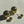 Load image into Gallery viewer, Gold earrings with round components on a light gray background
