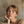 Load image into Gallery viewer, Woman reading a newspaper with a neutral background
