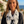 Load image into Gallery viewer, Woman wearing a white scarf with black anchor patterns outdoors near a scenic location.

