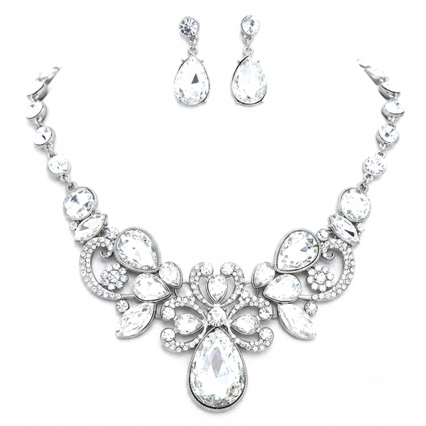 Jewelry set with necklace and earrings featuring teardrop-shaped crystals on a white background