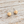 Load image into Gallery viewer, Matte gold ball stud earrings on pale rustic wood
