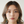 Load image into Gallery viewer, Woman wearing earrings with a neutral background
