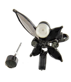 Black floral earring with pearl center on a white background