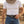 Load image into Gallery viewer, A man wearing a white crew-neck t-shirt, blue jeans, and a black leather belt with a large silver-toned decorative buckle, standing in a sunlit outdoor setting.
