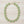 Load image into Gallery viewer, A green and gold statement necklace featuring round faceted green gemstones in textured gold bezel settings, with a gold-tone chain extender and clasp, shown on a plain white background.
