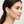 Load image into Gallery viewer, Woman wearing a pearl earring with a neutral background
