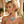 Load image into Gallery viewer, Woman wearing a luxurious emerald and diamond necklace and earrings outdoors.

