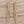 Load image into Gallery viewer, Golden cascading crystal earrings on pale barn wood
