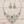 Load image into Gallery viewer, Green crystal necklace and earrings on pale barn wood
