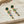 Load image into Gallery viewer, Gold earrings with green gemstones on a marble surface

