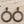 Load image into Gallery viewer, Hammered gunmetal circle earrings on pale barn wood
