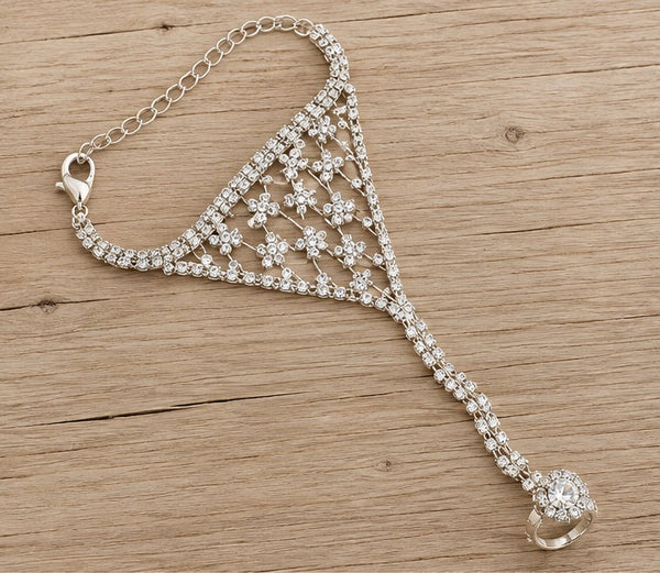 Crystal floral hand chain on pale wood