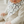 Load image into Gallery viewer, Baby wearing a white bib with black horseshoe patterns
