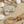 Load image into Gallery viewer, Silver bracelet with beads on a sandy surface with stones and rope
