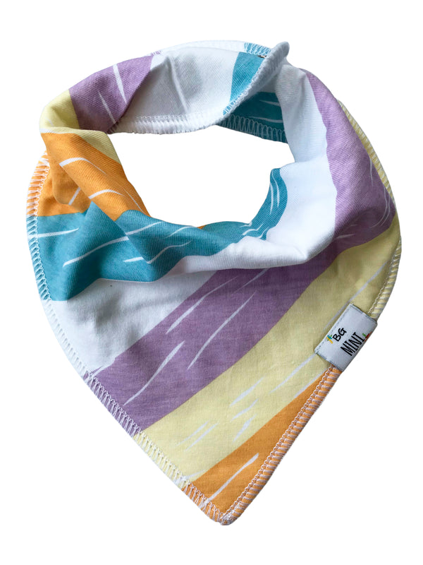 Colorful baby bib with geometric patterns on a white background