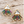 Load image into Gallery viewer, Rainbow crystal fan stud earrings on pale barn wood
