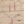 Load image into Gallery viewer, Red and clear crystal necklace and matching earrings on pale rustic wood
