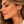 Load image into Gallery viewer, Woman wearing ruby red rhinestone gold-tone chandelier earring
