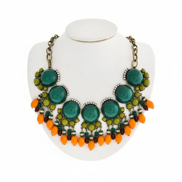 Jewelry set with necklace and earrings on a white stand