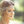 Load image into Gallery viewer, Woman wearing a decorative headband with a blurred natural background
