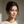 Load image into Gallery viewer, Woman wearing gold hoop earrings and necklace against a neutral background
