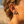 Load image into Gallery viewer, Close-up of a person wearing earrings with a beach background
