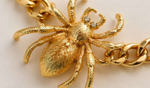 Close-up of sculpted gold spider pendant