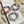 Load image into Gallery viewer, Three bracelets on a marble surface with a beach setting
