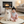 Load image into Gallery viewer, Baby sitting on a round mat with a white dog, in a cozy living room setting.
