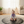 Load image into Gallery viewer, Baby sitting on a round mat in a living room
