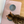 Load image into Gallery viewer, Cat drinking from a blue bowl on a pink mat with 'unif?gals' branding.

