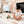 Load image into Gallery viewer, Child playing with toys on a rug in a living room.
