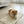 Load image into Gallery viewer, Small dog lying on a quilted mat in a bright living room.
