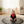 Load image into Gallery viewer, Baby sitting on a round mat in a living room
