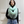 Load image into Gallery viewer, Person wearing a light blue scarf with white fringe in front of a white paneled wall.
