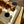 Load image into Gallery viewer, Cat eating from a bowl on a mat with a blue bowl in the background
