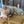 Load image into Gallery viewer, Small dog lying on a brown cushion with 'uniklook' branding
