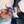 Load image into Gallery viewer, Person wearing colorful patterned wristbands on a checkered floor
