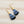 Load image into Gallery viewer, Blue + Black Feather Gold Statement Earrings
