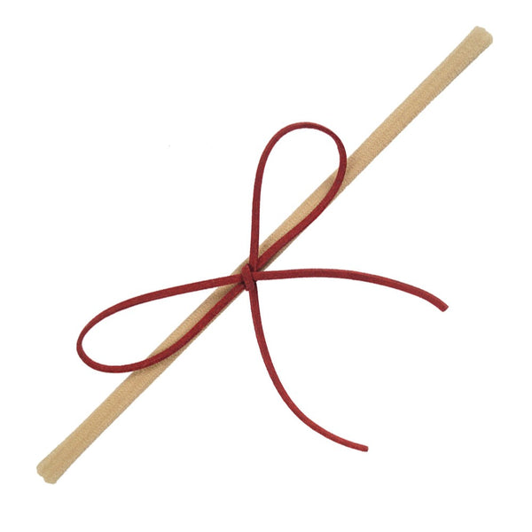 Sleek suede knot bow