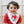 Load image into Gallery viewer, A baby wearing a red shirt and a white bandana bib with the text 'I love milk' printed on it.
