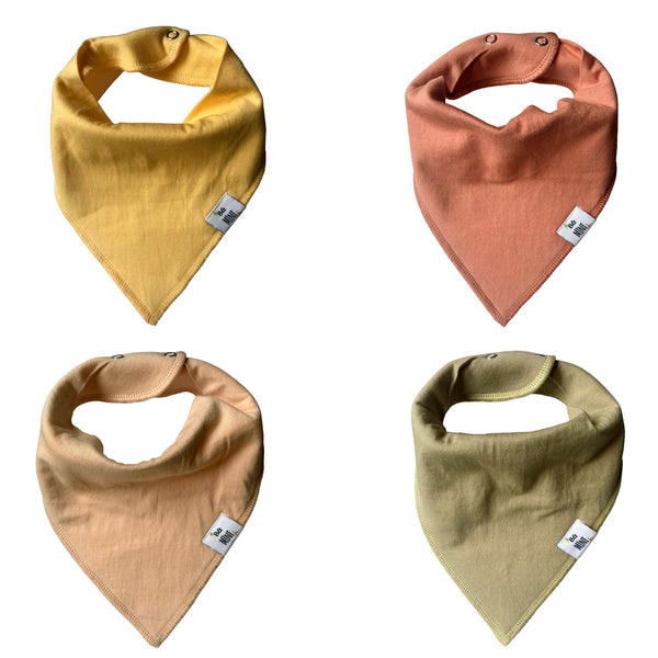 A set of four bandana bibs in beige, yellow, pink, and green colors with adjustable snaps.